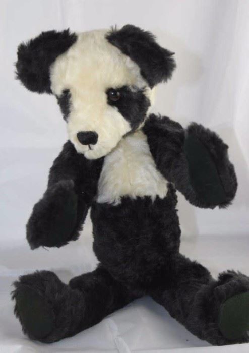 Tgler - 10. By Cynthia Glickman - Willow Creek.  Plush (distressed) black and white. Modeled on the  Chinese Sun Bear (an extinct species). The body  colors (toso) are reversed from the regular panda  colors. Ltd. #1 of 1.

