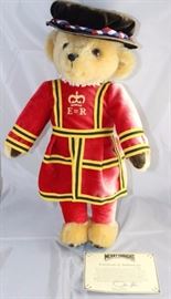 Harrods Beeffeater-513, Merrythought-England in  mohair golden.  "Made for Harrod's" with the label  on the bottom of foot.  Red uniform  with a black  flat pork pie hat with intertwined ribbons.  
