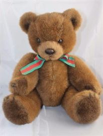 Brownie - 29. 1985 Char Company Plush-Brown  chocolate mix bear in excellent condition. Red,  green and gold ribbon-striped tie. Size:  18" H Excellent condition.
