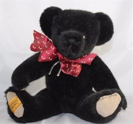 Blackridge-339, Merrythought-England in plush  black.  Has gray suede paw pads signed on bottom.    Burgundy with white ribbon neck bow and  ironbridge wishbone. Size:  10" H
