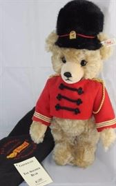Steiff Teddy Bear - FAO Musical Toy Soldier  Bear-759 in the bag.  Musical box bear plays "Welcome To  Our World of Toys".  Has light beige flannel paw  pads and a shaved snout.  
