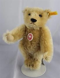Steiff Teddy Bear - Barle PAB Mini-97.  Jtd.  caramel mohair bear with cream flannel paw pads.   Wears a white elephant historic chest tag. Size:  6" H Excellent Condition.
