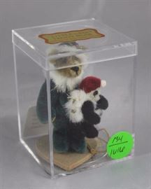 Little Gem Teddy Bear - Nicholas (Xmas) Mini - 520 In the box, velvet plush-green/gold.  1995  Christmas (pairs with Alexandra) comes in acrylic  box, with tag and wooden heart stand.  Small bear  with white faux fur around neck.  
