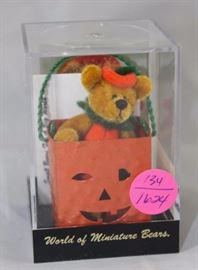 World of Mini Teddy Bear - Punkin Bear (Halloween)  Mini-828 In the box, velvet-orange/gold + tin.   World of Miniatures.  Punkin's body is orange  velvet, his head and arms are gold velvet.  He has  a green ruffle and a pumpkin top hat.  
