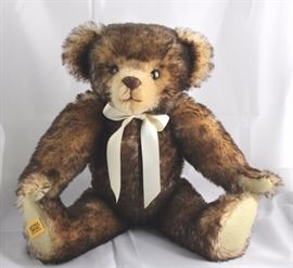 Willie-280, Merrythought-England, in brown and  apricot mohair.  Has tan flannel paw pads, a cream  neckbow, and growler.  Ltd. #012 of 540. Size:  15" H Excellent condition.
