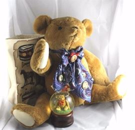 Teddy (Smithsonian)-327 1987 reproduction of  original Teddy Roosevelt bear by the Smithsonian  Museum.  Cocky head and hump back of the original.   A blue patterned scarf around his neck holds  Teddy Roosevelt campaign buttons.  Comes with bag
