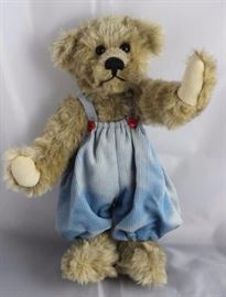 Little Boy Blue-213.  Wears blue corduroy rompers  with red buttons.  Signed on tag and hang tag.   Ltd. #034 of 100. Size:  12" H Condition:  Some fading on outfit.
