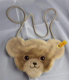 Steiff Teddy Purse-A131.  Yellow ear tag #600104. Size:  9 1/2" from ear to ear, 6 1/2 " from chin  to top of head. Excellent condition.
