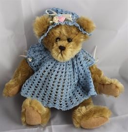 Bluebelle Michelle-210.  Blue crochet dress and  bonnet with cream ribbons.  The bonnet hat also  has multi-colored satin flowers.  The bear is  pellet stuffed and signed on the tag.  Ltd. #11 of  50.
