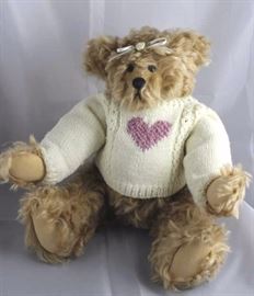 Evangeline-207.  White long sleeved hand knit  sweater with purple heart.  White head ribbon tied  with fabric flower and bow.  Signed on tag.  Ltd.  #03 of 50. Size:  14 1/2" H
