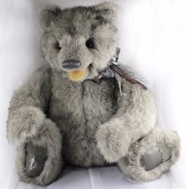 Something's Burnin - 146. 1996 Gund Signature  Collection in plush gray tipped. Stands 29" H in  excellent condition. Has dark gray leather paw  pads with suede toes and an open tan velveteen  mouth. Wears a sheer multi-hued gray and brown ribbon
