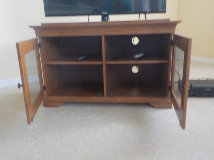Television Stand with Glass Doors. Light Wood Finish