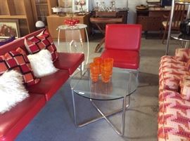 Red vinyl sofa and chair, chrome and glass table