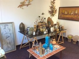 Pottery, copper art, on glass and bamboo table.  Tiled table 