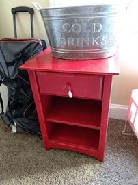 This red nightstand goes with the dresser seen earlier.