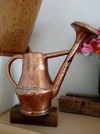 Antique copper watering can