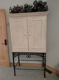 White cabinet on stand, would make a great liquor cabinet