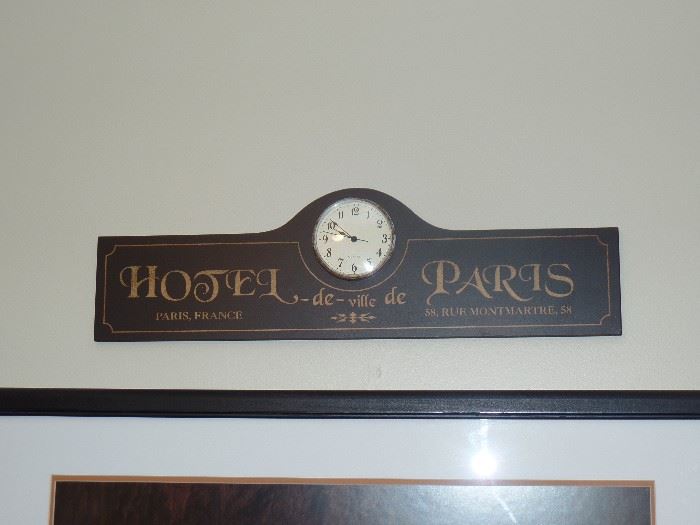 Really cool clock and sign of Paris