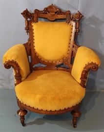 277a  Oversized gentlemans walnut Victorian chair with yellow upholstery, possibly John Jelliff, 42 in. T, 34 in. W, 23 in. D.