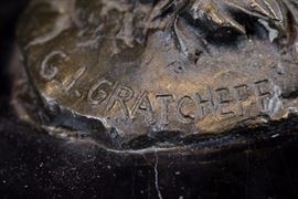 301e  Bronze cowboy herding cows, signed GI Gratcheff, 10 in. T, 15 in. W, 6 in. Dia.