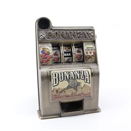 "Bonanza" Toy Slot Machine: A Bonanza savings bank toy slot machine, manufactured by Radica Games in 2001.