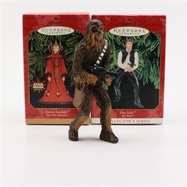 Hallmark "Star Wars" Keepsake Ornaments: A grouping of Hallmark Star Wars Keepsake Ornaments. This grouping features three character ornaments from the Star Wars franchise. Included is Chewbacca, Han Solo, and Queen Amidala. The ornaments are marked to the undersides and the original boxes are included.