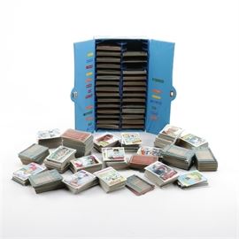 Baseball Cards and Sorting Box: A collection of baseball cards. This collection contains several hundred circa 1977 baseball cards of various players and teams. Some of the collection is held in a segmented card box that is in the form of a sports locker; with each section featuring sorted sections of cards based on the team.