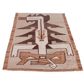 Handwoven Peruvian Wool Area Rug: A handwoven Peruvian wool area rug. The rug is made of two seamed panels which depict a stylized scorpion. The field is worked in an undyed natural wool background which includes shades of brown and gray. The design itself incorporates variegated shades of rusty brown, espresso, and buff. The simple border consists of a band of rust-colored wool. Unmarked.