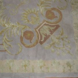 Wool and Silk Hand Tufted Area Rug: A wool and silk hand tufted area rug manufactured by Global Accents, Inc. Comprised of New Zealand wool and silk and designed with vine and medallions on a field of ash blue with earth tone shades. Tag to underside.