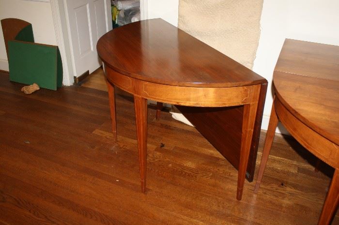 This is a gorgeous Demilune gateleg banquet table that seats 12.  It is so versatile in that you can have two Demilune side tables when not used for a dining room table.