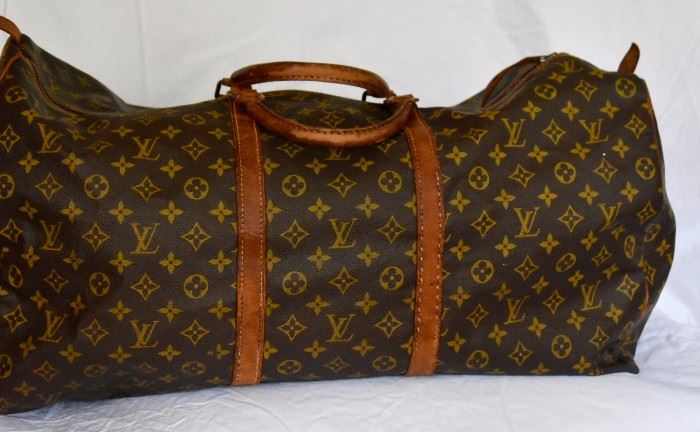 Set of Louis Vuitton Duffel Bags (2).  Purchase now at: www.manorbornestatesales.com