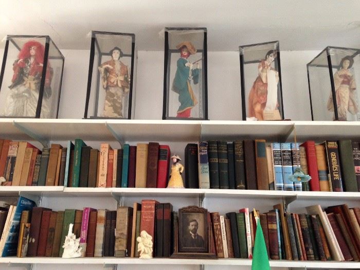 antique books and Japanese dolls