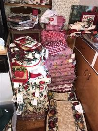 TONS OF KITCHEN TOWELS, CUSHIONS, POT HOLDERS, OVEN MITTENS AND MORE