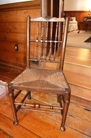 English rush bottom chair with shell crest on back, stretcher base and pad feet; 20”w  x 37”h x 15”d
LOT 203