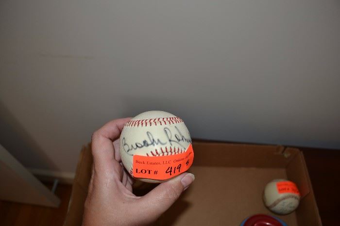 5 baseballs, some signed, one signed Brooke Roh…(?), some unsigned
LOT 419