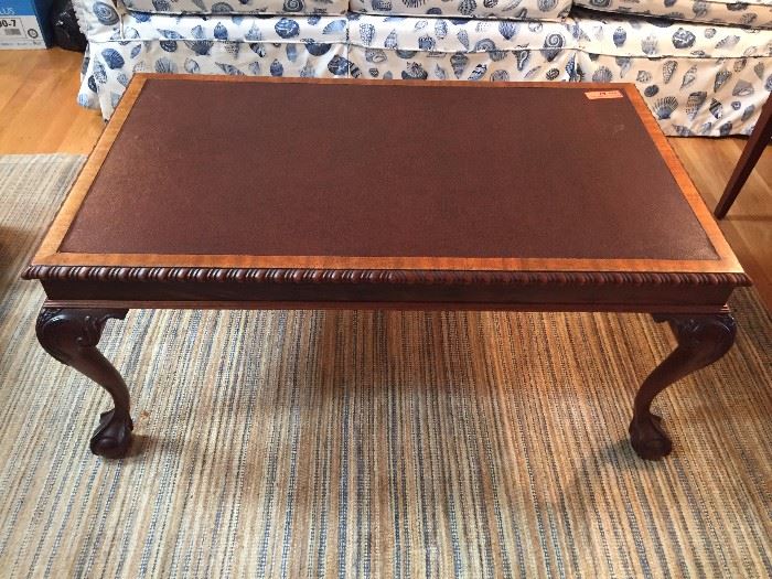Leather top coffee table with cabriole legs and ball and claw feet; 39”w x 17”h x 22”d
LOT 61