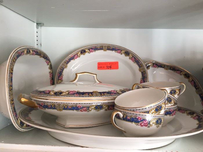 Service for 11, includes 11 dinner, 11 dessert, 12 B/B plates, bowls, cups and saucers, lidded serving dishes, gravy boat, sugar, oval platters.  Some are chipped most in good condition.  Retailed for Tressemann & Vogt
LOT 104
