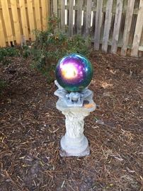 Gazing ball on concrete pedestal with molded motif
LOT 709