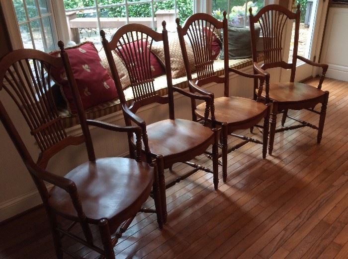 Four all wood kitchen chairs