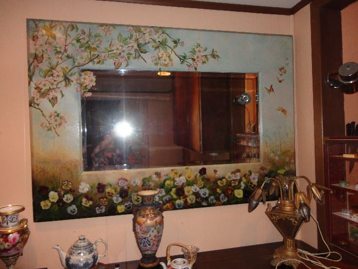 This magnificent beveled glass mirror takes up a whole wall - hand painted apple blossoms,  pansies and butterflies. 