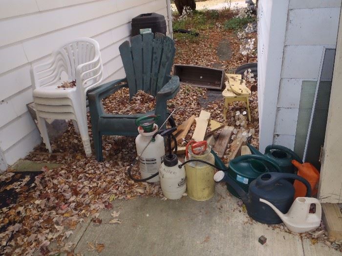 yard chairs,sprayers,watering cans, wood door