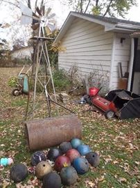 windmill lawn roller, bowling  balls, leaf rake,wheel barrows