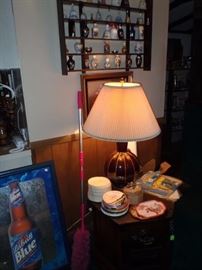 beer signs, lamps, bell collection shelf, lamps. endtables