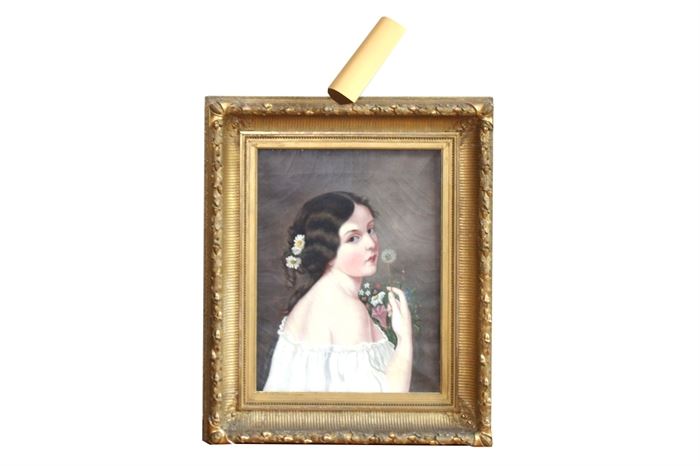 Antique Oil on Canvas Portrait of a Young Woman: An antique oil on canvas portrait. This original work depicts the portrait of a beautiful young woman wearing an off-the-shoulder white gown. Daisies hold back her dark brown hair. She holds a bouquet of flowers with a single dandelion seed head raised to her lips. The artist does not appear to be credited. The canvas is housed in an antique frame with gilt finish. A hanging wire and light are attached to the verso.