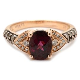 Le Vian 14K Rose Gold Garnet and Diamond Ring: A 14K rose gold fashion ring by Le Vian featuring a garnet to the center with arrow-shaped shoulders adorned diamonds and more diamonds to the top-half of the shank.