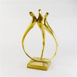 Figurative Brass Bird Sculpture: A figurative brass bird sculpture. This vintage mid-century sculpture features three birds that join together in a circular design, over a square base. Unmarked.