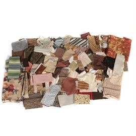 Large Assortment of Fabric Samples: A large assortment of fabric samples. This assortment includes fabric in varying styles, material, and sizes. Patterns include paisley, floral, checked, striped, plaid, woven, polka dot, and more.