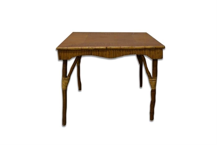 Bamboo Table: A bamboo table. It has a square top with a parquetry style design formed from cut splints, and a serpentine apron formed from the same. It stands on bamboo legs with corner supports.