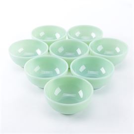 Set of Fire King Green Glass Jadeite Bowls: A set of Fire King green glass jadeite bowls. Included in this collection are eight matching green soup or cereal bowls. Maker’s marks present on the underside.