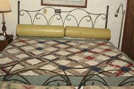 OLD QUILT ON IRON KING BED